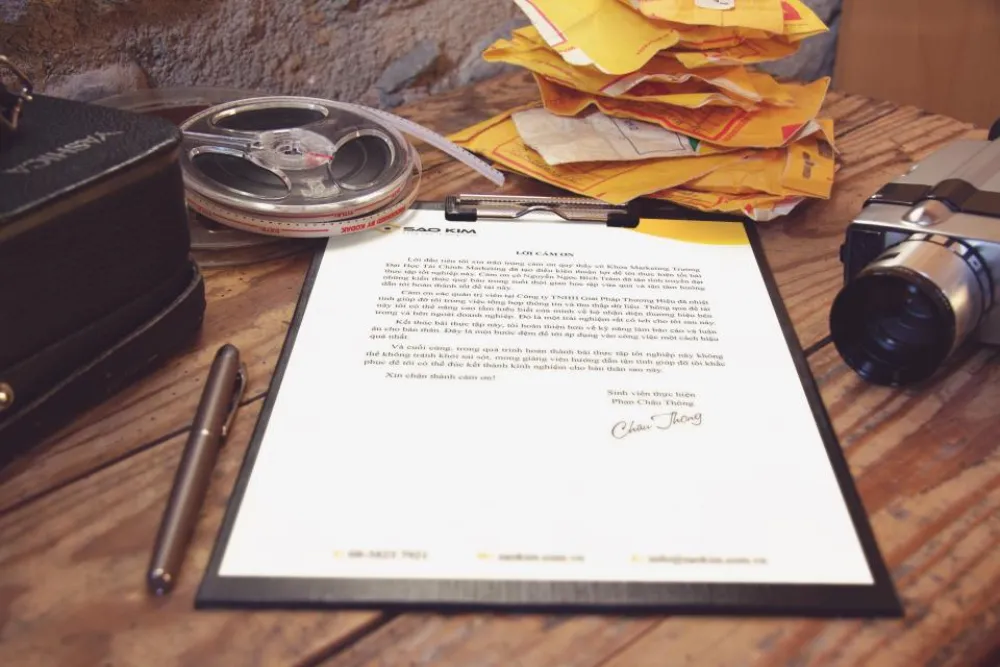 Printed documents and paperwork on a desk, the kind of German business and technical files sent for translation