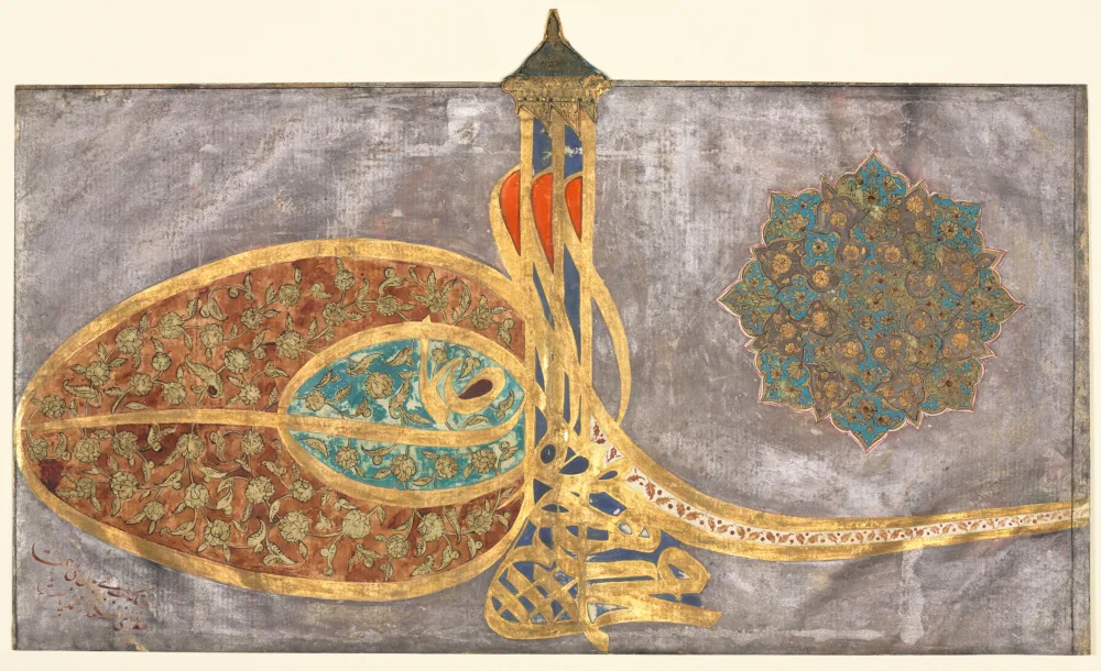 Ottoman calligraphy artwork with intricate gold decoration on aged paper, showing the pre-1928 Arabic-script Turkish writing